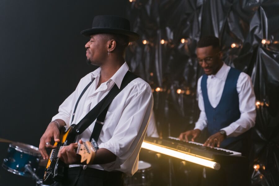 A band on stage under lights